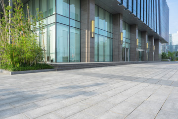 modern glass building exterior with empty pavement,copy space,shanghai,china.