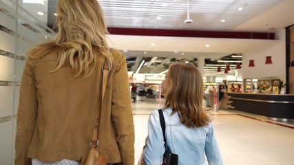 Wall Mural - Mother and daughter shopping day together