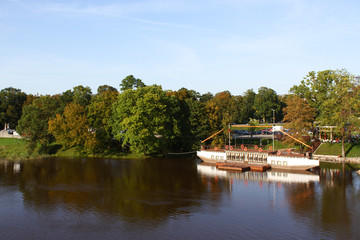 Countryside city view of river with trees.