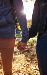 Wall Mural - Man and woman holding hands