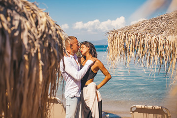 Sexy couple. Couple. Sea background. Life. Dream. Fashion concept. Kiss. Kissing.