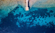 Drone view of a pontoon with clear blue open waters