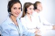 © rogerphoto - Call center. Focus on beautiful business  woman in headset