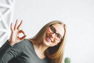 Poster - European woman showing ok gesture