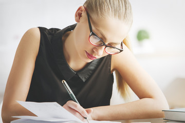 Poster - European woman doing paperwork