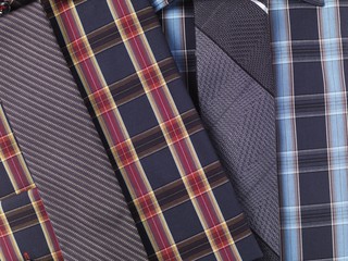 Men's red and blue tartan pattern collared shirts with slim ties, closeup
