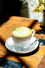 Wall Mural - Green tea matcha latte in white cup