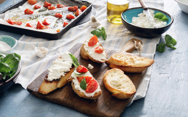 Wall Mural - Ingredients for cooking Italian bruschetta on dark table