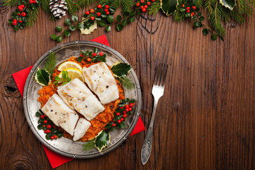 Christmas fish. Roasted cod pieces, served in vegetable sauce.