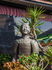 buddhist statue in a flower garden