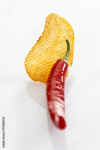 Fotografie, Obraz Paprika potato chips with a chili pepper