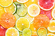 Citrus fruits background various slices top view background. Vitamin c fruits.