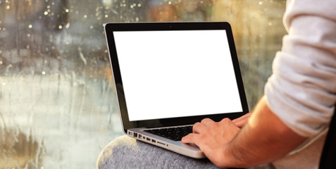 Man working with a laptop at home, copy space