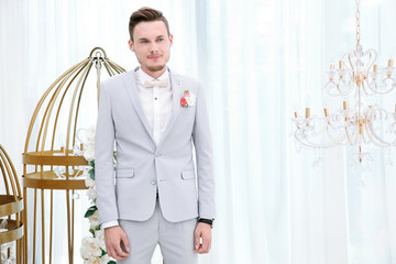 Wall Mural - Handsome groom on wedding day, indoors