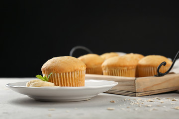 Poster - Plate with banana muffin on table