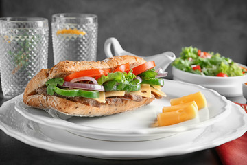 Wall Mural - Plate with steak sandwich on table