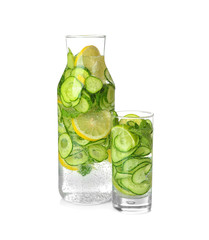Fototapete - Bottle and glass of fresh cucumber water with lemon, isolated on white