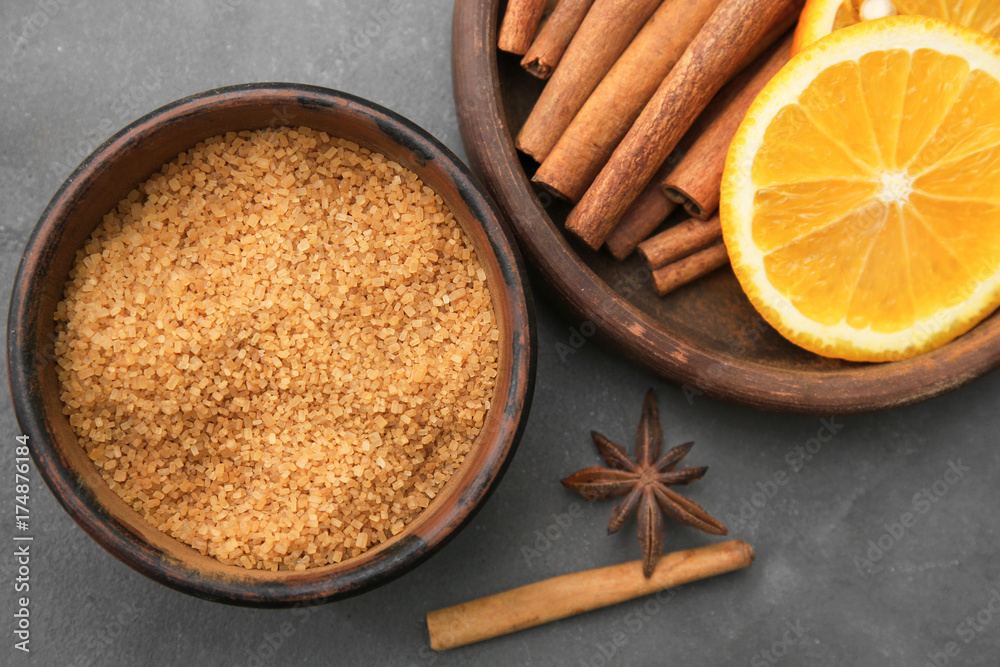 Composition with cinnamon sugar and sticks on table