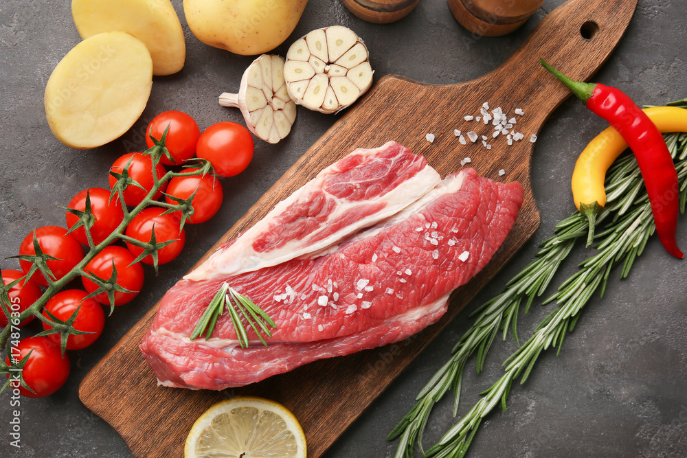 Fresh raw meat on wooden board