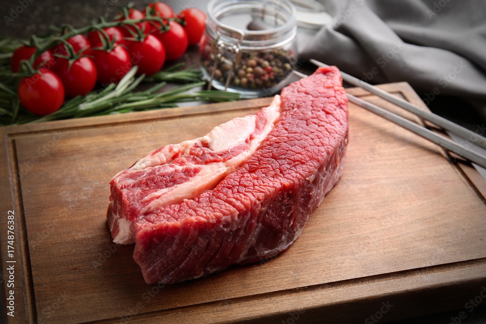 Fresh raw meat on wooden board