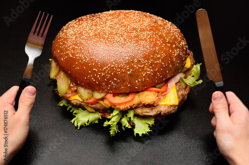 Fotografia  Huge giant big burger on a dark background close-up