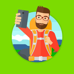 Canvas Print - A hipster man with the beard making selfie on the background of hilly countryside. Man with backpack taking photo with cellphone. Vector flat design illustration in the circle isolated on background.