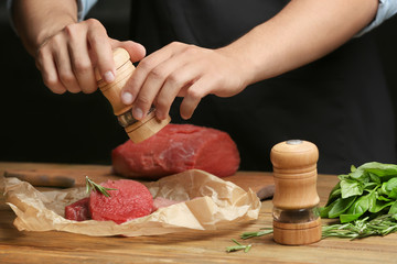 Poster - Chef cooking meat on table