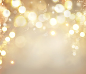 Wall Mural - christmas golden background. holiday abstract glowing background with blinking stars