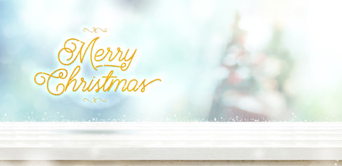 Aufkleber - merry christmas gold glitter on white wooden table with abstract muted blur christmas tree and snow 
