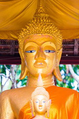 Wall Mural - Statues of buddhist gods, Louangphabang, Laos. Close-up. Vertical.