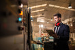 © ADDICTIVE STOCK - Formal man controlling factory