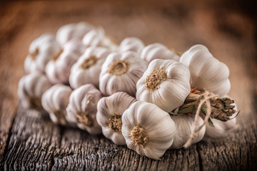 Wall Mural - Garlic. Garlic bulbs. Fresh garlic on rustic oak table.