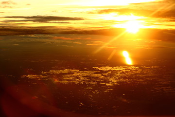 Wall Mural - Sunset White Cloud sky at high level attitude, view from window airplane