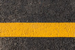 Yellow line on the road texture background