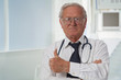 © dream@do - Portrait of an old senior experienced male doctor with a stethoscope in hospital. Health care and medical concept.