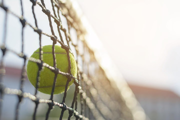 Close up Tennis ball hitting to net