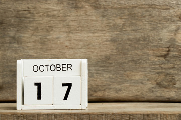 Sticker - White block calendar present date 17 and month October on wood background