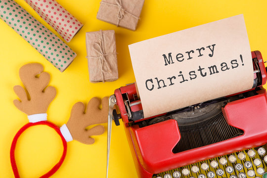 Christmas concept - red typewriter with the text 