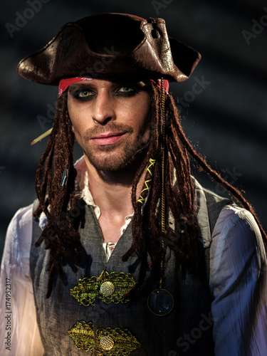 Portrait of a young man in a pirate costume.