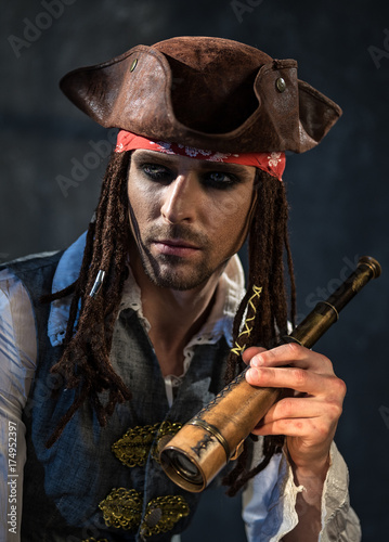Portrait of a young man in a pirate costume.