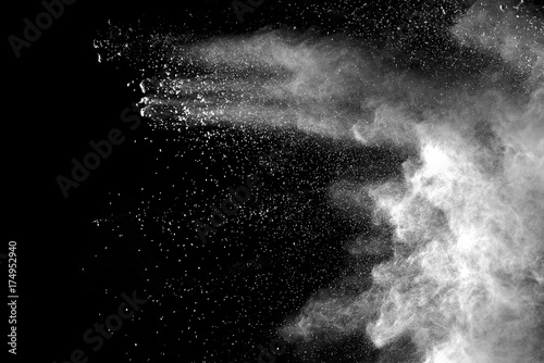 Fotografía Explosion of white dust on black background.