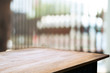 © mojo_cp - empty wooden desk over blurred interior decoration background