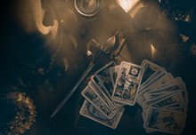 Tarot Card / View Of Tarot Card On The Table Under Candlelight. Dark Tone.