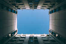 Low Angle View Of The Sky Between Buildings