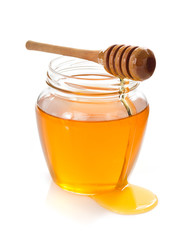 Wall Mural - glass jar full of honey and dipper