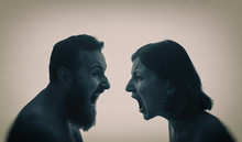 A Man And A Woman Scream At Each Other. The Concept Of A Family Quarrel, Violence, Misunderstanding.