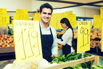 Wall Mural - shop people standing near cabbage in grocery