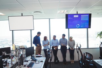 Wall Mural - Business colleagues standing at office