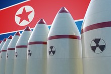 Nuclear Missiles And North Korea Flag In Background. 3D Rendered Illustration.