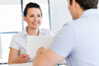 © Sergey Nivens - Image of two young business people in office